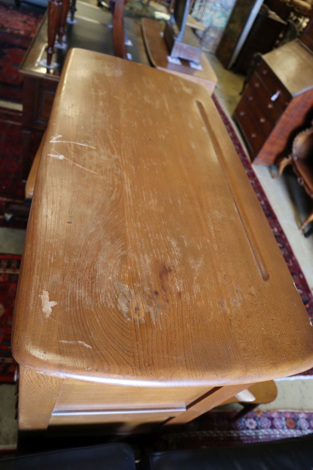 An Ercol cocktail cabinet, width 98cm, depth 46cm, height 150cm